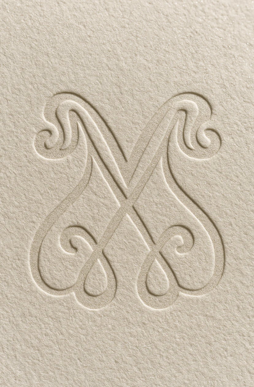 Elegant Embossed Monogram – Letter M Logo on Textured Paper for Luxury Stationery or Brand Identity