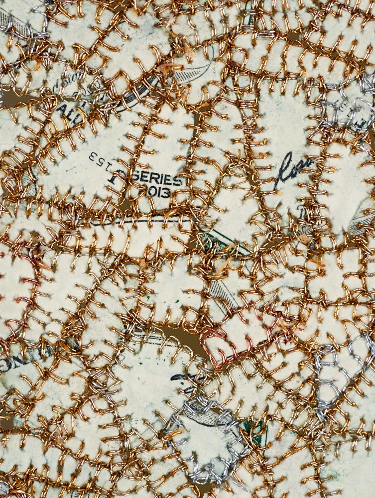 Art made from shredded money and thread